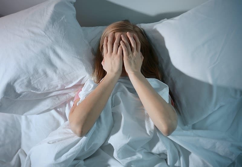 Person resting comfortably in bed